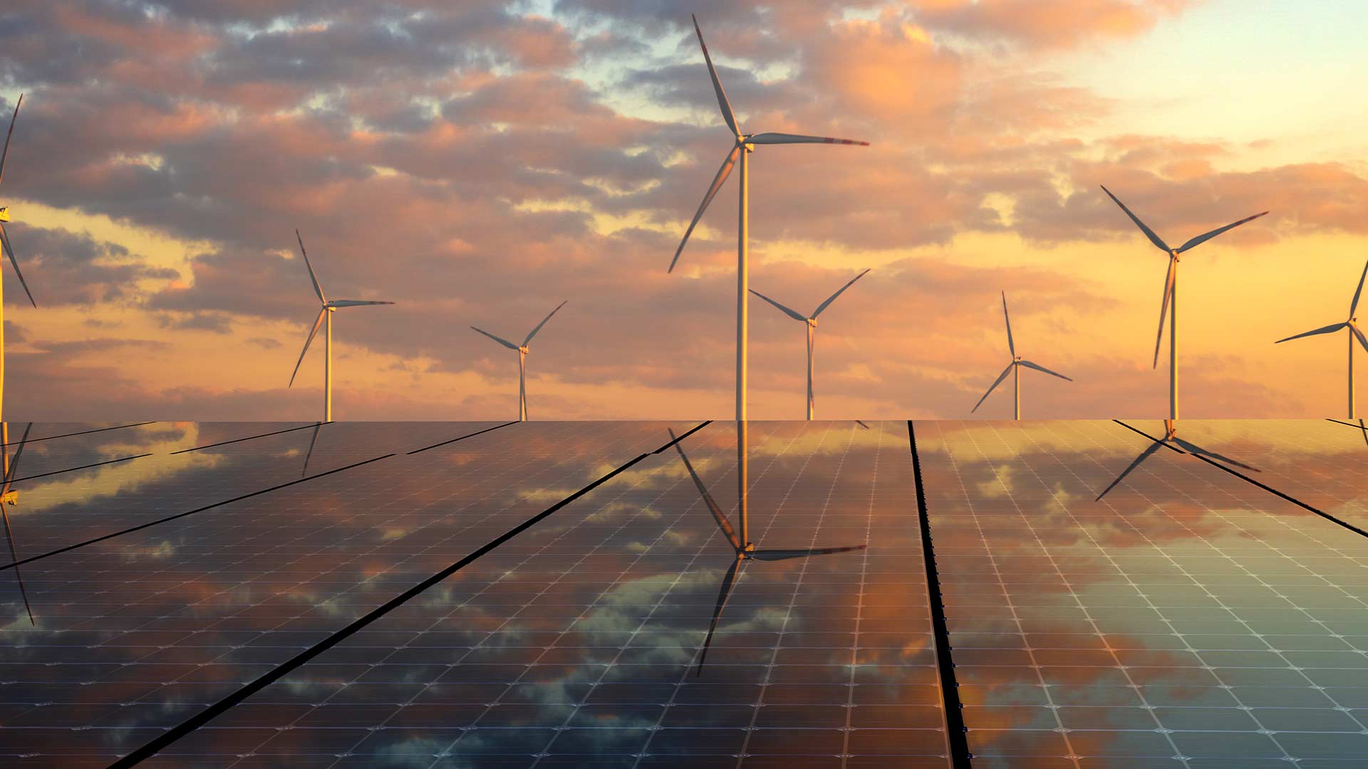 Ветряная электростанция, расположенная на открытом воздухе на фоне пастельного неба и облаков.